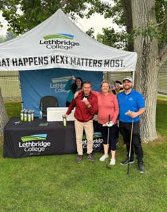 golfers standing at booth