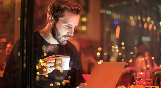 Night Man looking at laptop