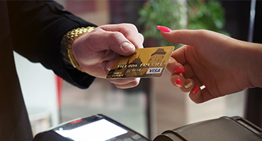 Credit Card Man paying with a credit card