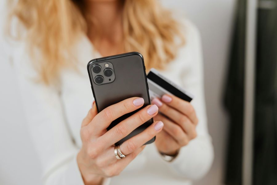 Woman Using Mobile Credit Card App Promo Woman Using Mobile Credit Card App Promo