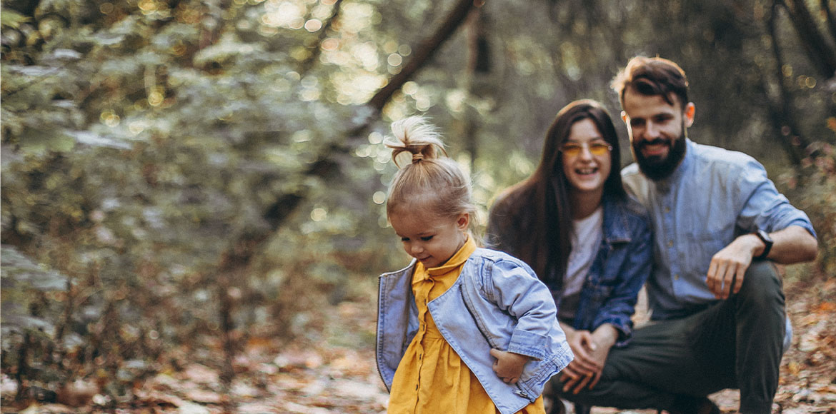Toddler And Family Playing In Forest Resp