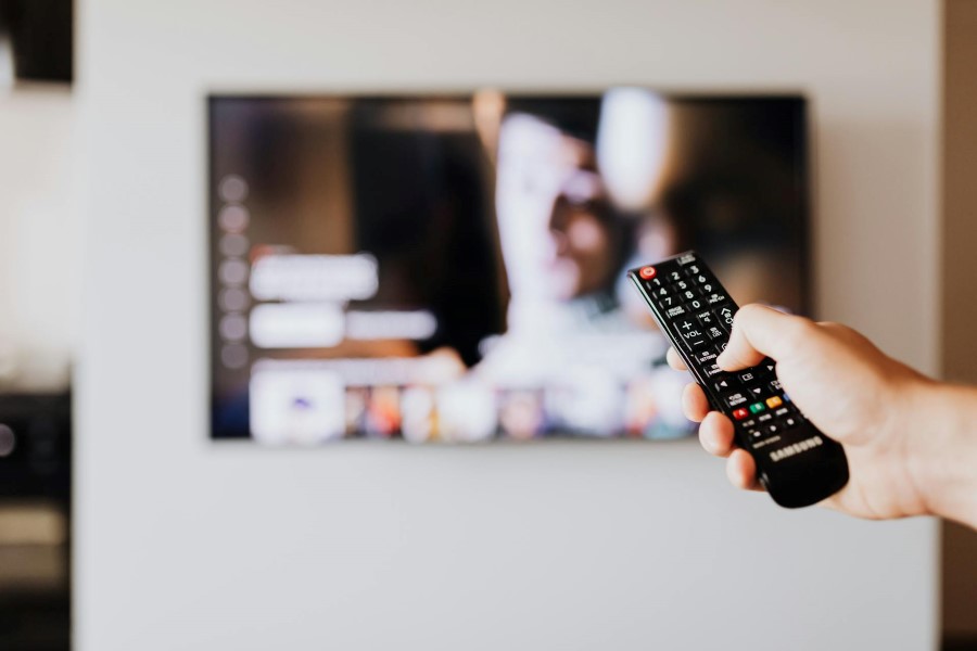 Person Holding Tv Remote To Watch Streaming Spring Mcc Campaign Card Person Holding Tv Remote To Watch Streaming Spring Mcc Campaign Card